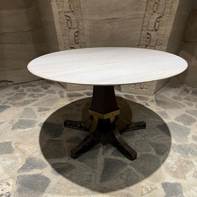 AMBIANIC presents Dining Table new White Marble Top Sculptural Base Base is mahogany wood and iron, finished with gilt-...