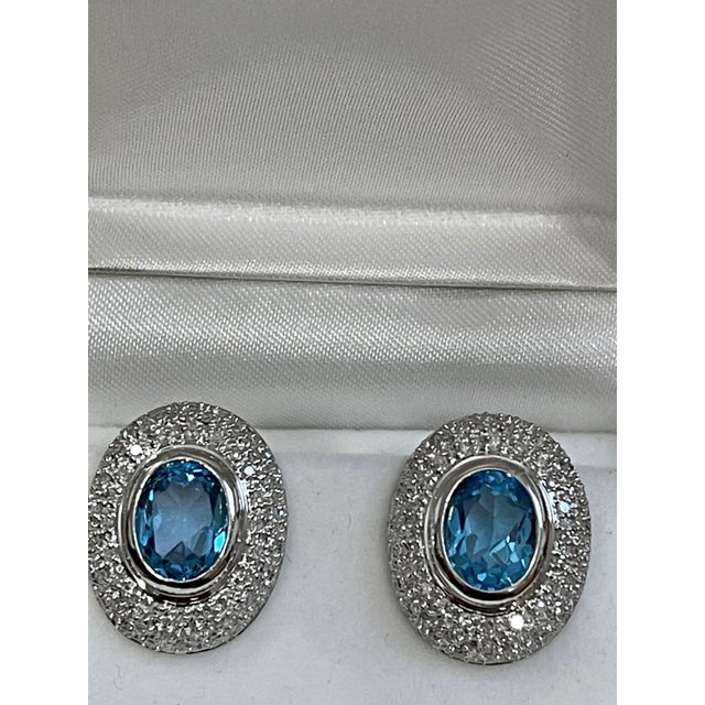 Contemporary 5 Carat Oval Shape Blue Topaz and Diamond Omega Back Clip Earring 14 Karat Gold For Sale - Image 3 of 18