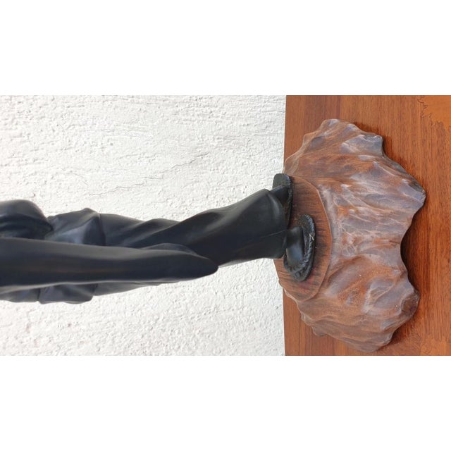 Brown patina bronze of a young Japanese woman wearing a kimono and carrying a parasol. Wooden base Worn patina 19th...