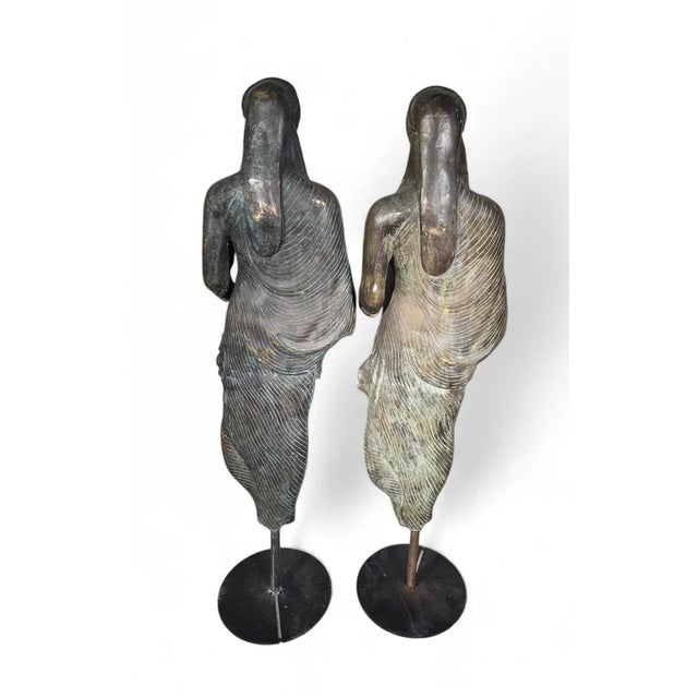 Title: Pair of Bronze Sculptures of the Kore of Peplos - Early 20th Century with Modern Bases Product Overview: This...