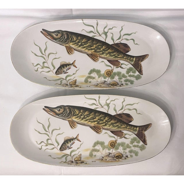 Wonderful Naaman Ltd. china fish serving set in the "Muskey Fish" pattern. Two platters measuring 14" x 6.25" with 12...