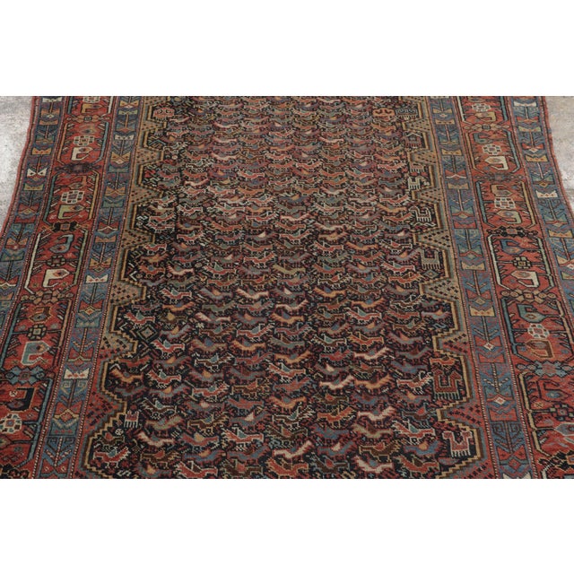 This 4x6 Antique Khamseh Qashqai rug, handwoven in wool and dating to circa 1890–1909, showcases the tribal artistry of...
