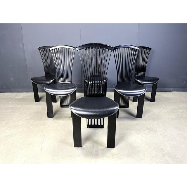 Beautiful 'fan' chairs designed by Pietro Costantini. Lacquered wooden frames with faux leather black seats. Good...