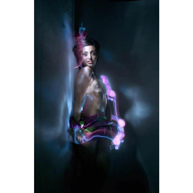 Light painting technique, realized in the dark duck studio, whertiother "paint" by torch with light of different colours,...