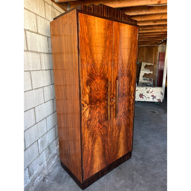 Exceptional Art Deco armoire / wardrobe of beautifully compact proportions, likely European in origin. The spectacular...