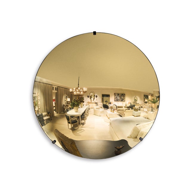 The gold contemporary convex mirror, inspired by European design and finished in French gold with light antiquing,...