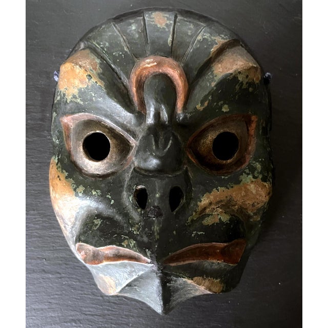 A striking Japanese carved wood mask with polychrome paint and lacquer surface. This rare mask is dated to the Edo period...