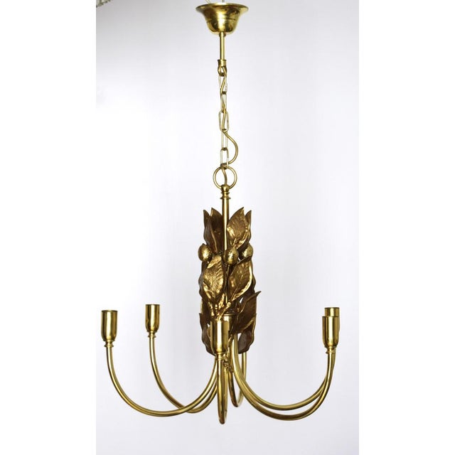 A very solid and heavy chandelier in the style of Maison Charles from the mid-20th century. The high-quality craftsmanship...