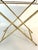 Stylish, gold-shaded, folding, metal bar table in a faux bamboo design with raised gallery and mirrored top. Great condition.