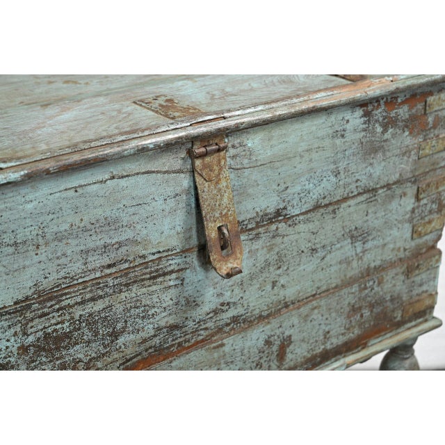 Antique Indian Painted Teakwood Blanket Chest, in the colonial style on inverted baluster legs, a top supported by iron...