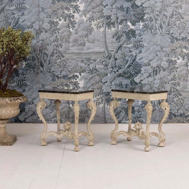 A beautiful pair of French Regency side tables with deep green Campan marble tops from a private home outside of Paris....