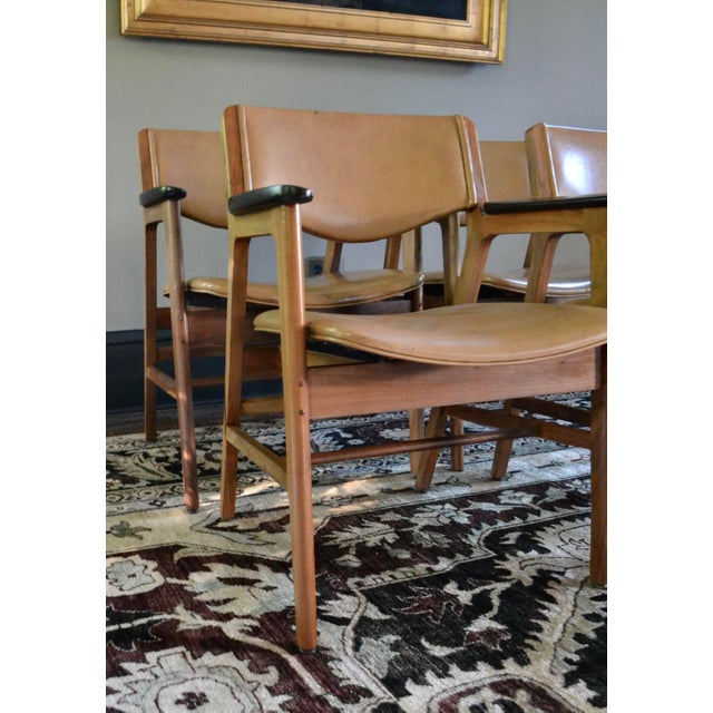 Set of 4 very cool Jens Risom style walnut arm chairs by Gunlock Chair Company. Great rare mid century modern detailing...
