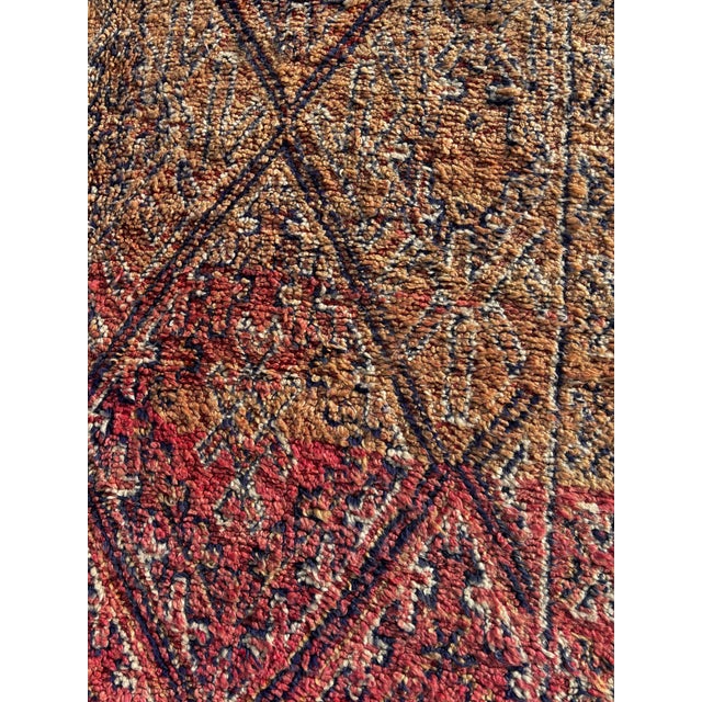This exceptional vintage Moroccan Boujad rug is a powerful example of mid-20th-century Berber textile art, handwoven in...