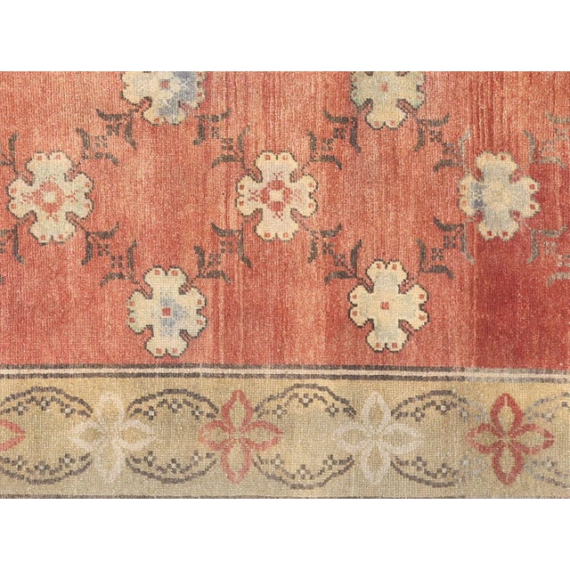 This beautiful vintage Turkish Oushak Rug is hand-knotted with 100% wool on a wool foundation to provide a soft, warm...
