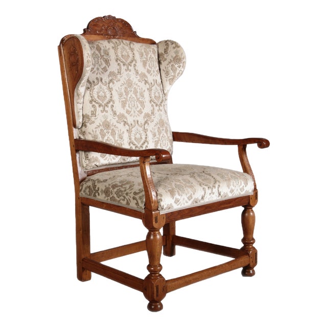 Antique Baroque Wingback Armchair with Carvings, 1800 For Sale