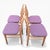 A stylish set of four mid-century teak ladder back dining chairs, showcasing classic Scandinavian-inspired design from the...