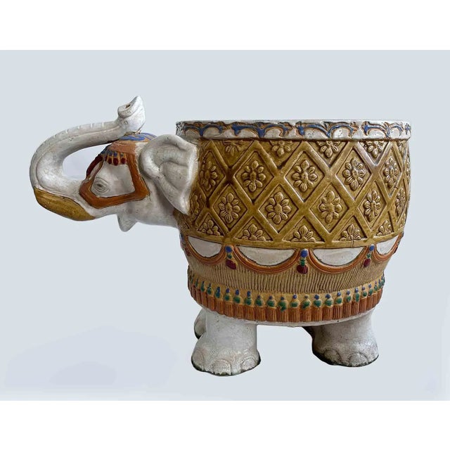 Vintage European hand painted and glazed terracotta decorated elephant planter. Great coloration and craquelure in the...