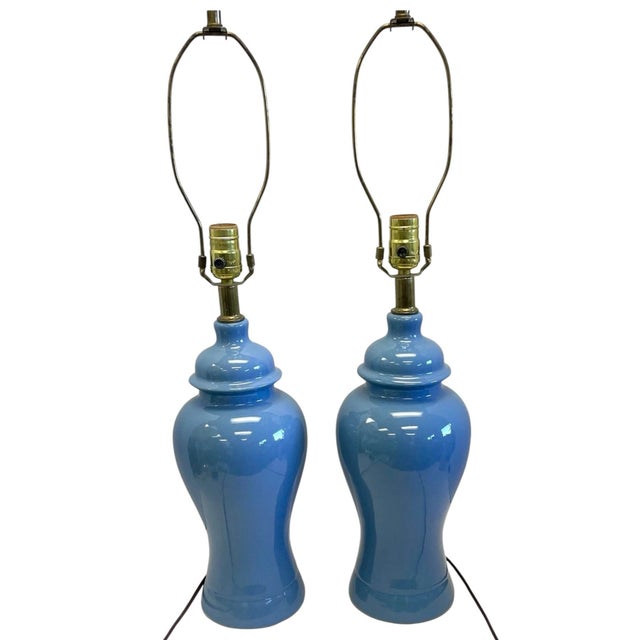 A stunning pair of vintage 1970–80s glossy blue ginger jar table lamps featuring a rich, vibrant glaze and classic ceramic...