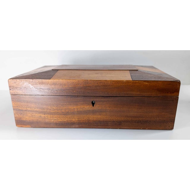 We are selling this nice decorative two tone mahogany veneered box. The box is most likely European, English or...