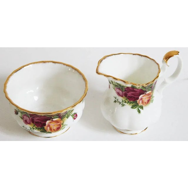 Royal Albert china, Old Country Roses pattern creamer and open sugar bowl. Measures: creamer, 3 3/4" high op of spout, 1...