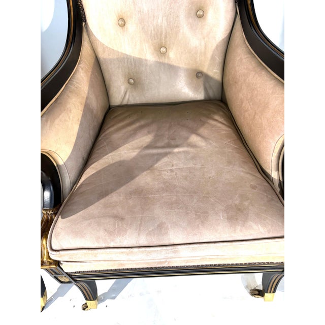 A pair of vintage Classical Revival Armchairs of fine quality by Baker Furniture. Ebonized finish with gilt pinstriping....