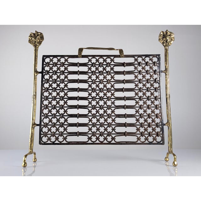 Brutalist fireplace screen by David Marshall, crafted in bronze with a spectacular central wrought ironwork of...