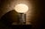 Large-format "Spring" model, characterized by a chromed steel base and an elongated opal glass shade with soft lines....