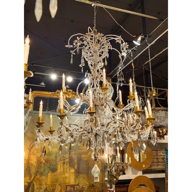 Large scale 19th century Italian beaded crystal and giltwood chandelier. Circa 1870. The chandelier has been...