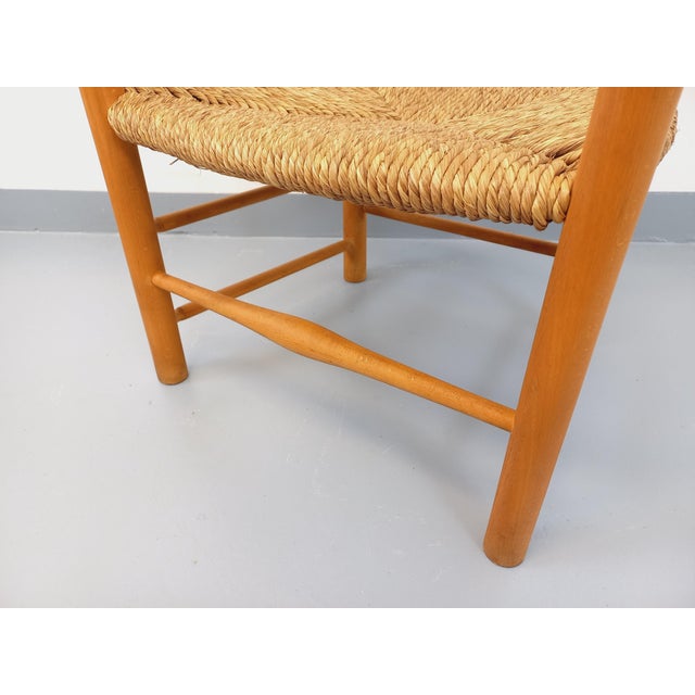 Large vintage armchair from the 1950s, beechwood back, legs, and armrests, straw seat, very good overall condition....