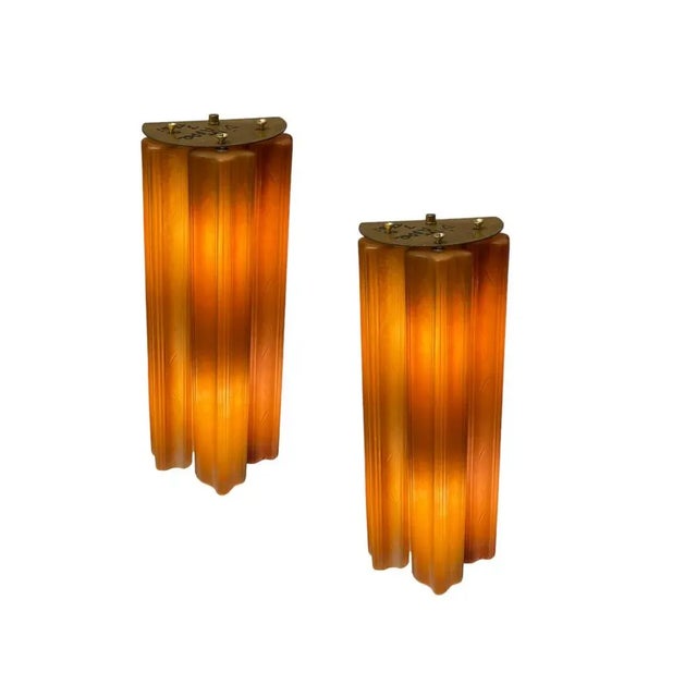Glass tube sconces set of 2 Formed of 3 Terracotta glossy glass tubes suspended from a metal base. Height 46 cm Width 19...