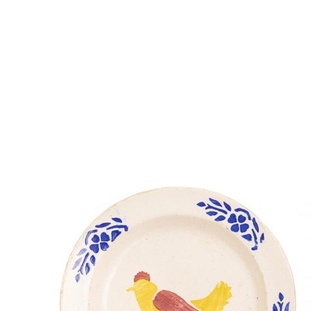 Earthenware - Two earthenware plates. Portuguese, manufactured in the early 20th century, polychrome glazed decorations...