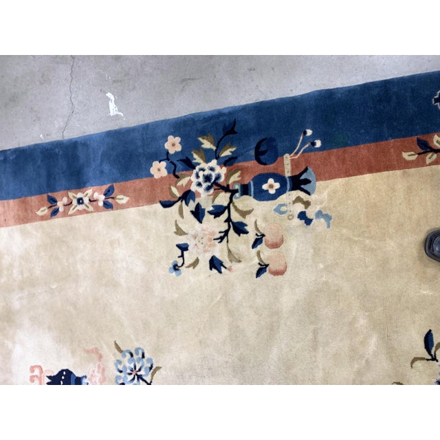 Handmade vintage Art Deco Chinese rug in beige and blue shades. The rug is from the beginning of 20th century in original...