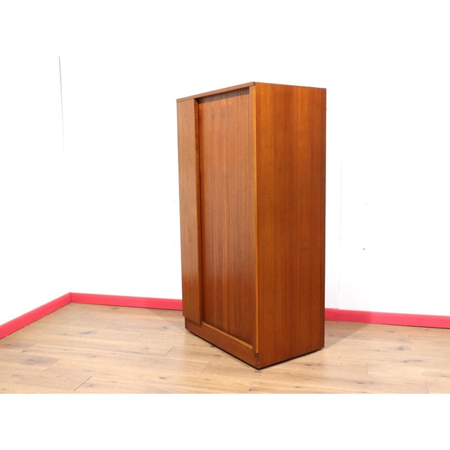 Introducing the stunning Mid Century Modern Vintage Armoire Teak Wardrobe by Austinsuite, a timeless piece that will...