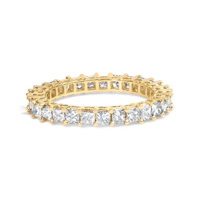 Captured in this exquisite creation is the essence of eternal elegance – a 14K yellow gold eternity band that whispers...