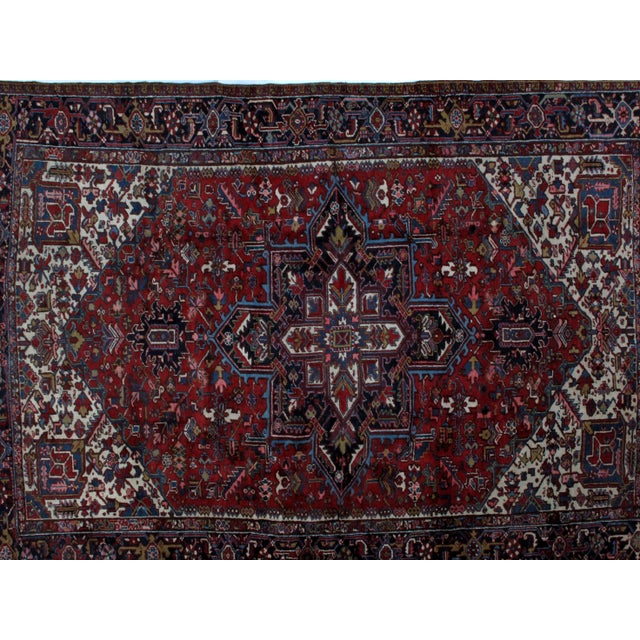 Wool pile hand made Vintage Persian Heriz carpet in excellent condition.