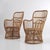 Pair of armchairs, Italian-made, 1960s Circular frame made entirely of rattan with sinuous shapes. Armchairs in good...