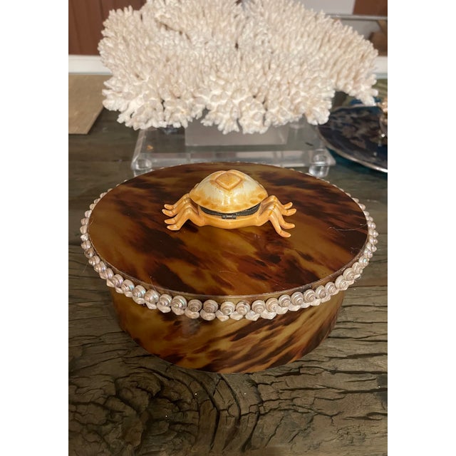 Fabulous vintage oval paper box in tortoiseshell pattern With tiny sea shells trim border and antique porcelain crab pill...