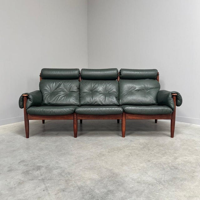 Mid century lounge sofa by Eric Merthen for Ire Möbel AB, Sweden 1960s. Oak frame with green leather uphostery. Sofa is...