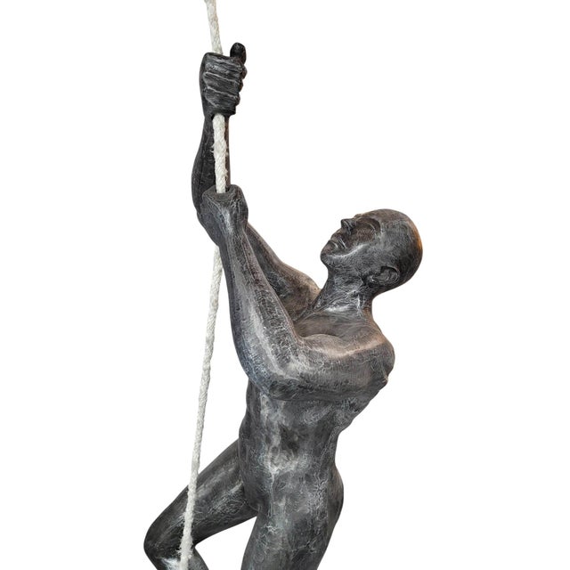 This contemporary climbing figure by the Phillips Collection transforms architectural space into a work of art. Standing...