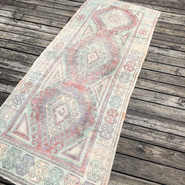 A Vintage Avanos Runner with Geometric Depth and Tribal Charm This vintage runner rug from the Avanos region of Turkey is...