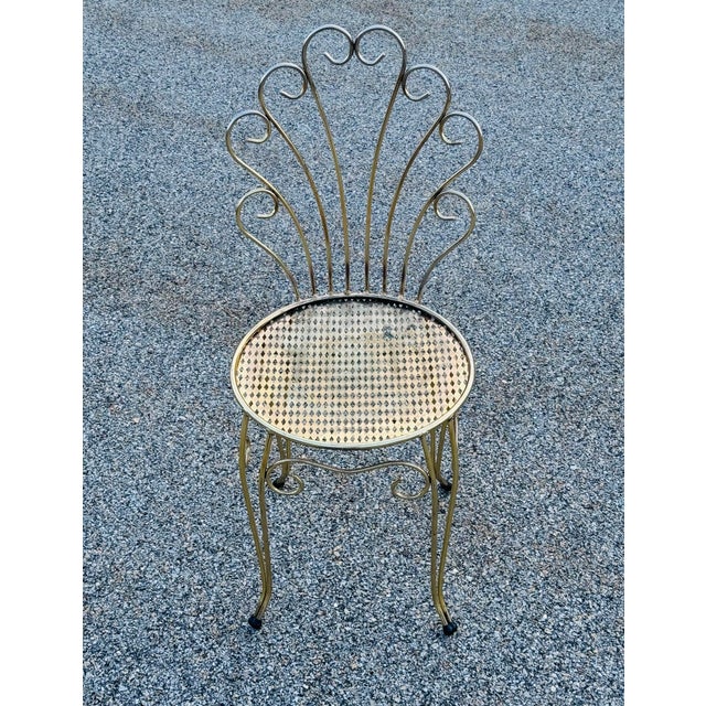 Vintage 1960s Gold Metal Vanity Chair Bring classic Hollywood Regency charm to your space with this vintage 1960s gold...