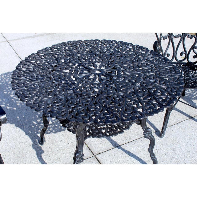 Mid-Century Ornate Cast Aluminum Patio Dining Set – Filigree Round Table With 4 Heart-Back Armchairs For Sale - Image 14 of 16