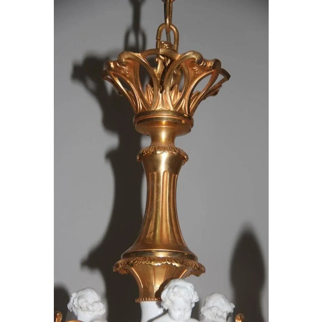 - Italian 1970s elegant and luxurious chandelier - Handmade and hand-painted porcelain - Hand-wrought and hand-painted...