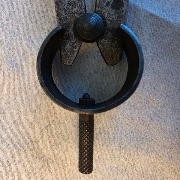 A striking architectural artifact of 19th-century engineering, these hand-forged inside calipers are a study in industrial...