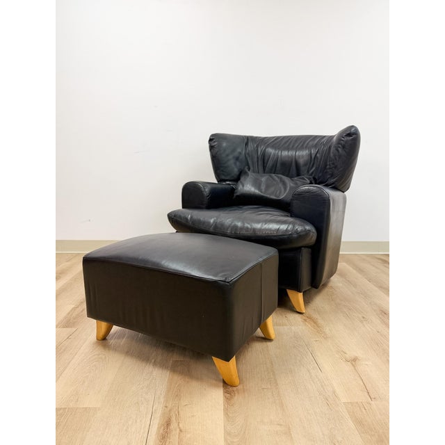 This sophisticated Calia Salotti black leather chair and ottoman set is a beautifully crafted Italian designer seating...