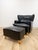 This sophisticated Calia Salotti black leather chair and ottoman set is a beautifully crafted Italian designer seating...