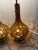 Capture the ultimate mid-century ambiance with this striking, rare pair of 1960s amber "genie bottle" table lamps. These...