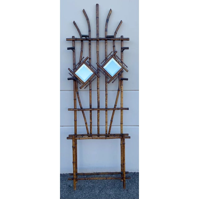 A rare and sculptural find from the late 19th century, this antique tiger bamboo hall tree is a stunning example of the...