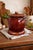 This vintage Hull Art Pottery bean pot features the iconic rich brown “drip glaze” finish that became a signature look in...
