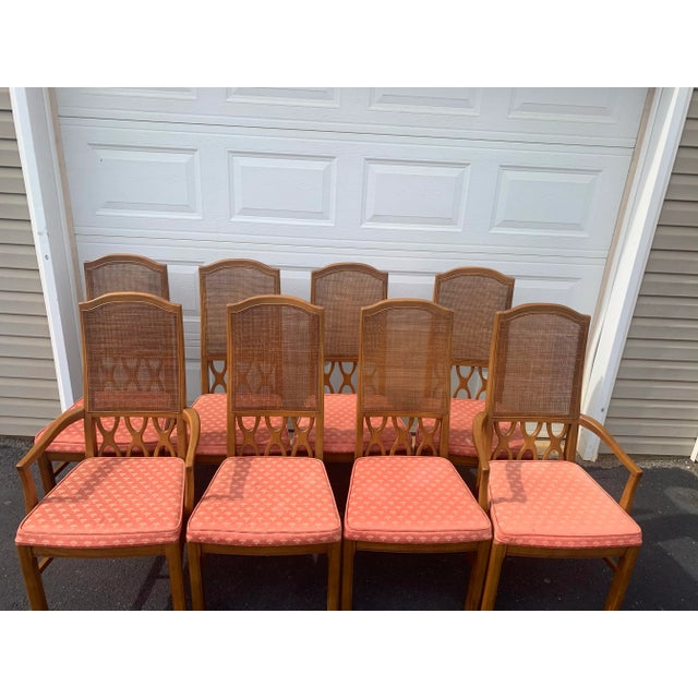 This set of eight vintage dining chairs combines timeless craftsmanship with casual elegance, featuring gently arched cane...